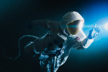Astronaut exploring outer space - obrazy, fototapety, plakaty