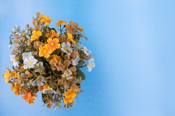 Fototapeta na wymiar Artificial flower bouquet decoration, copy space background