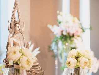 Thai wedding ceremony decoration with monk statue