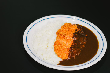 Katsu Curry Don, Pork Cutlet Japanese Curry Rice Bowl isolated on black background