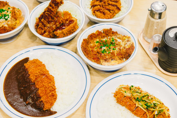 Many Tonkatsu or katsudon. Japanese deep-fried pork cutlet with egg and rice. 