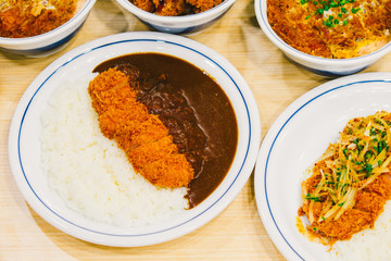 Many Tonkatsu or katsudon. Japanese deep-fried pork cutlet with egg and rice. 