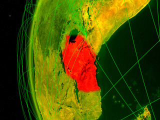 Tanzania from space on digital model of Earth with international networks. Concept of digital communication or travel.