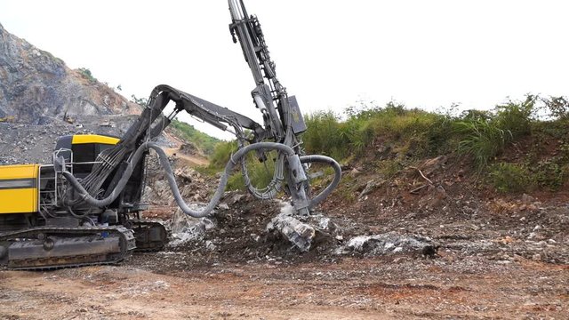 Rock surface drilling machine used to drill blast holes at quarry site