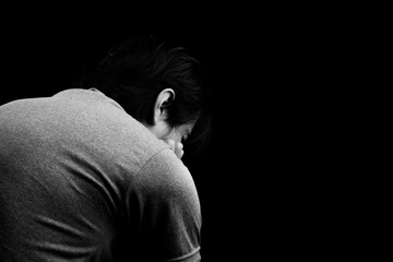 Man sad or cry alone in dark background asia people adult worry unhappy