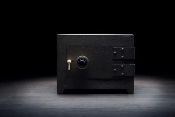 Foto op Canvas Steel bank safe on a dark background © fergregory
