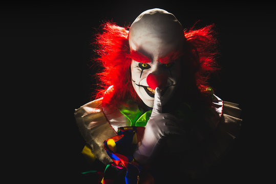 Scary clown on a dark background