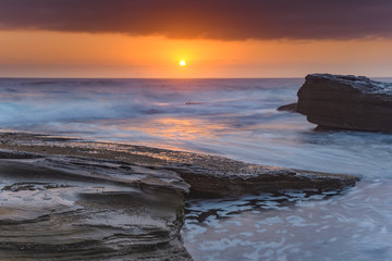 Fototapeta na wymiar An Atmospheric Sunrise Seascape