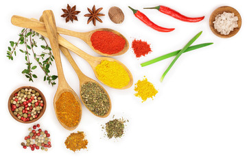 mix of spices in wooden spoon isolated on a white background with copy space for your text. Top view. Flat lay. Set or collection
