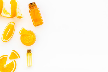 body treatment with citrus cosmetic set white desk background top view space for text