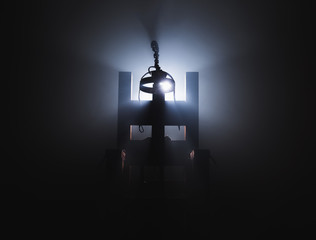Electric chair in a dark background