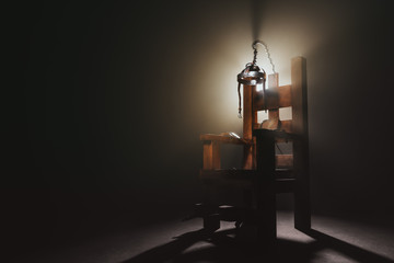Electric chair in a dark background