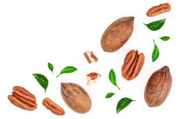 pecan nut decorated with green leaves isolated on white background. Top view. Flat lay