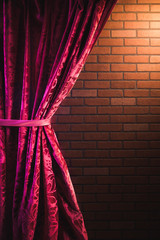 Brick wall and red curtain