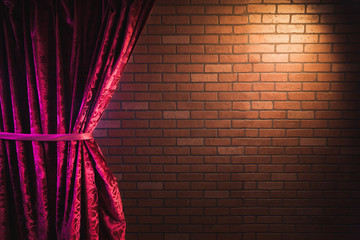Brick wall and red curtain - obrazy, fototapety, plakaty