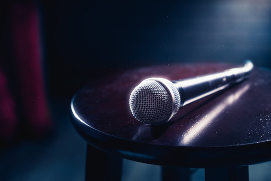 microphone on a wood stool on a stage