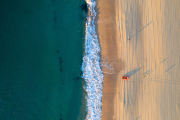 Sand with boat and ocean - Verticle