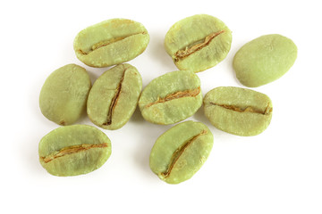 green coffee beans isolated on white background close up. Top view. Flat lay