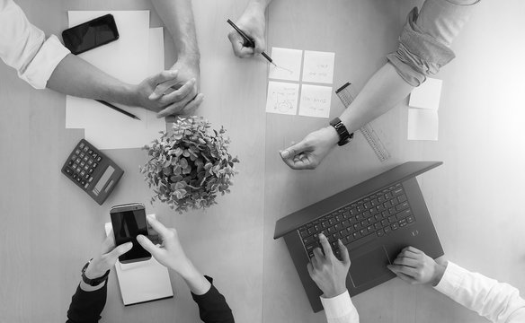 Teamwork Collaboration With Top-down Desk View At Office.  Brainstorming And Setting Goals Working Together.