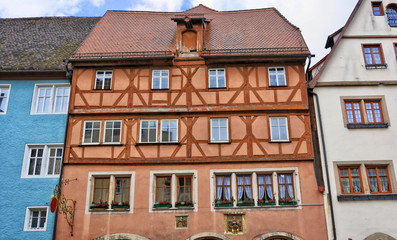 Fototapeta premium German architecture. Ancient half-timbered buildings with tile roofs. Medieval old town. Bavaria.