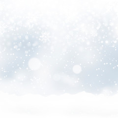 Blurred Christmas background with snowflakes and blue sky. Vector