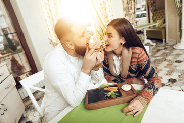 Happy man and woman having lunch in a restaurant