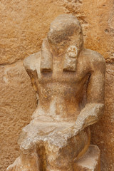 Old statue near pyramid temple in Giza, Cairo, Egypt
