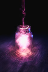 magic in a jar on a dark background