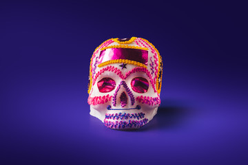 sugar skull in a purple background