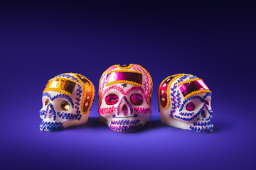 sugar skull in a purple background