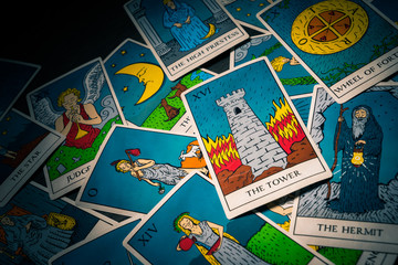 Tarot cards distributed randomly on top of each other - obrazy, fototapety, plakaty