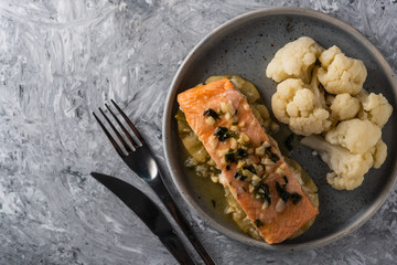 Solomon fillet with pineapple and cauliflower. Fish with vegetables.