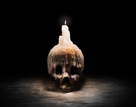 High contrast image of a skull on a table