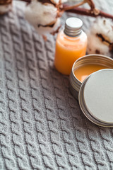 Natural spa cosmetics on a dark blue beton concrete background. Beauty blogger, minimalism concept, copy space