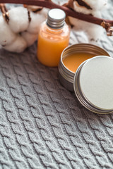 Natural spa cosmetics on a dark blue beton concrete background. Beauty blogger, minimalism concept, copy space