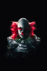 Scary clown on a dark background