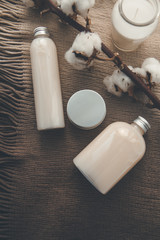 Natural spa cosmetics on a dark blue beton concrete background. Beauty blogger, minimalism concept, copy space