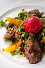 Salad with rabbit liver, Parmesan, raspberry sorbet and pine nuts.