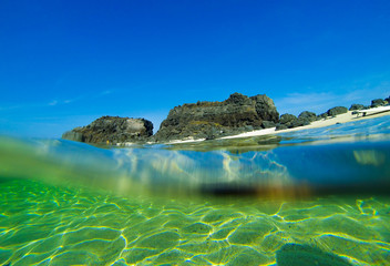 Surfboard on the wild beach