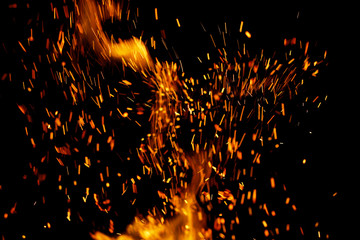 flame of fire with sparks on a black background
