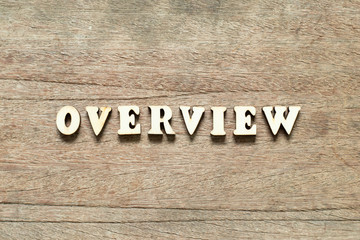 Letter block in word overview on wood background