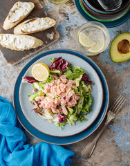 Ceviche is a traditional dish from Peru. Salmon marinated in lemon with fresh lettuce, avocado and onions