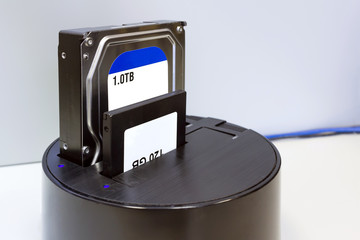 Hdd and ssd hard drives in the black rounded docking station. Illustration of repair and...