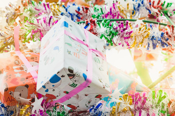 Colorful tinsel and gift decoration for a  Christmas tree and a