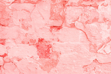 Texture, wall, concrete, living coral. It can be used as a background . Wall fragment with scratches and cracks