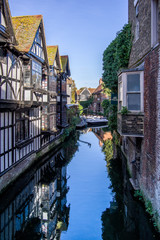 Landscape view of river Great Stour passing between houses. Canterbury, United Kingdom.