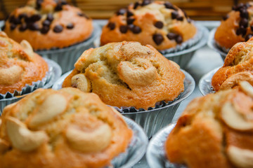Homemade banana cupcake on tray background.