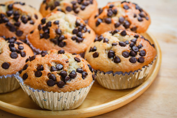 Homemade banana cupcake with wood background.