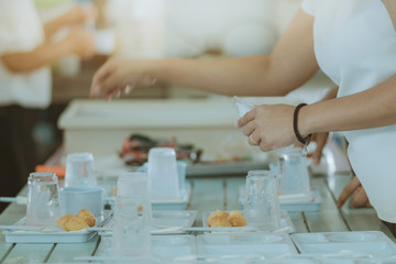 Woman prepare snack and beverage for conference lunch break