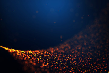 Golden fire particles trail wave blur on dark blue gradient background